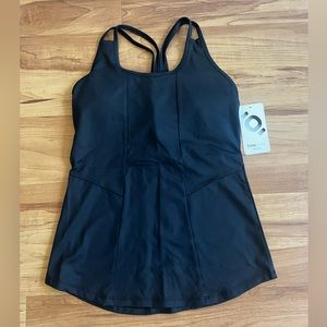 All black, razor back tank.